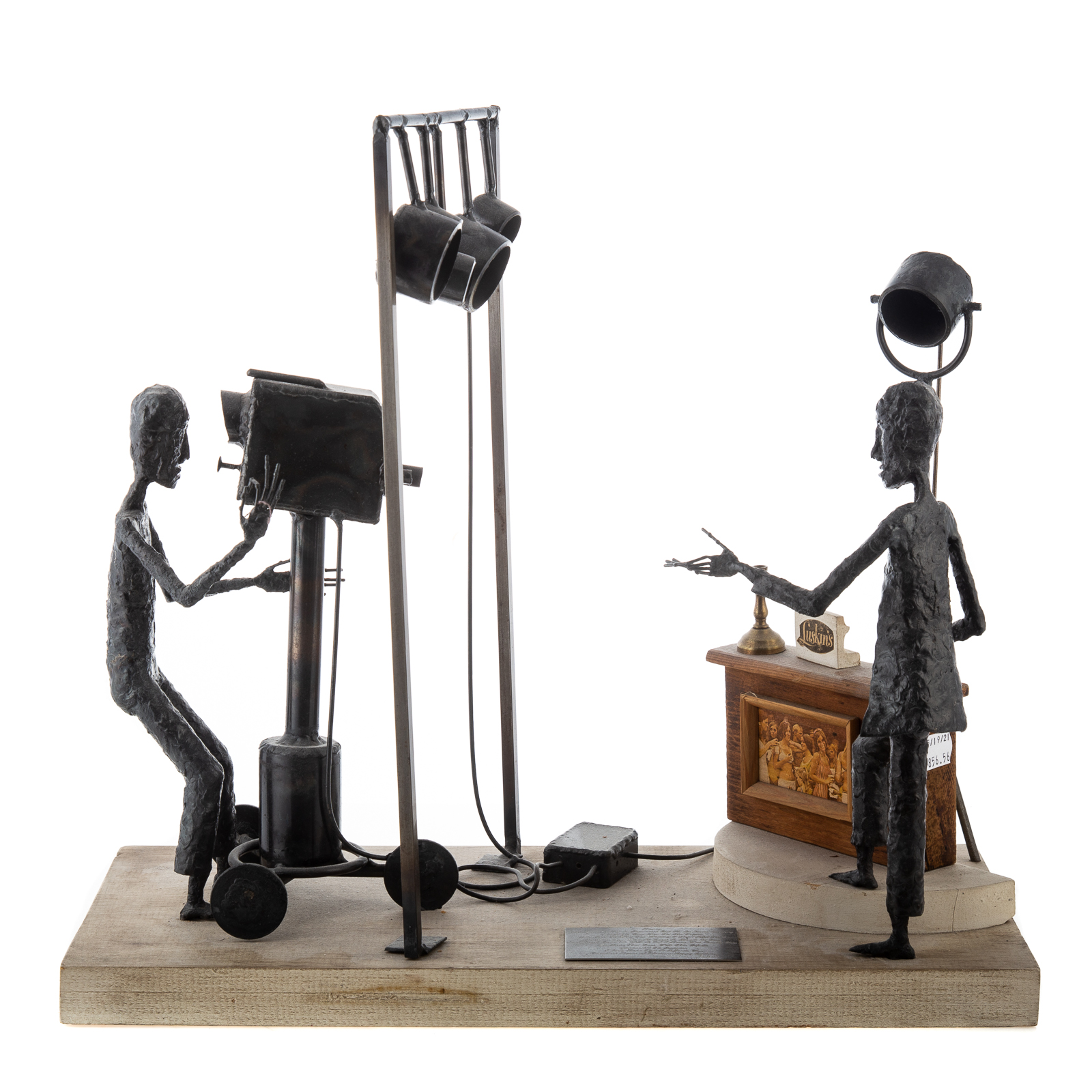 Appraisal: CONTEMPORARY SCULPTURE LUSKINS'S TV COMMERCIAL Brutalist metal figural sculpture with