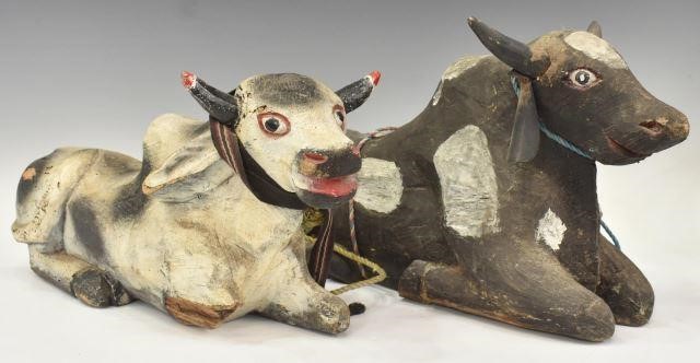 Appraisal: lot of Mexican carved wood recumbent cow sculptures each with