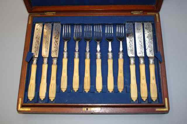 Appraisal: A CASED SET OF TWELVE IVORY HANDLED FISH KNIVES AND