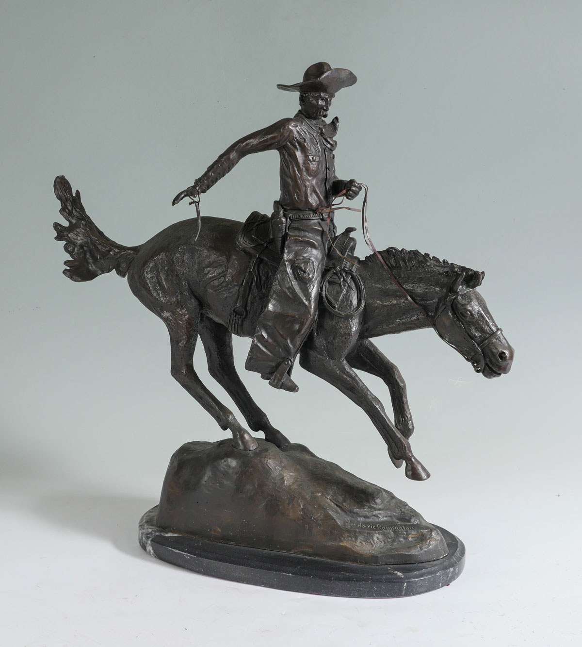 Appraisal: BRONZE COWBOY ON HORSEBACK SCULPTURE AFTER REMINGTON '' high with