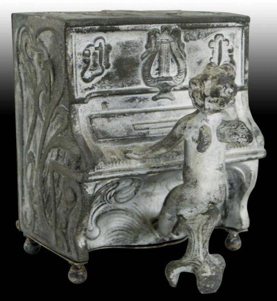 Appraisal: Musical Cupid At The Piano Mechanical Bank Description White Metal