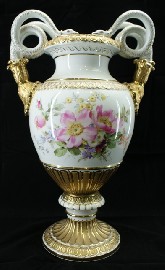 Appraisal: A German porcelain urn form vase with snake form handles