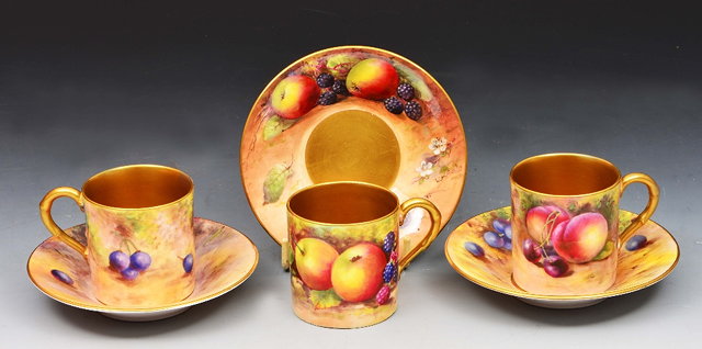 Appraisal: Three Royal Worcester coffee cans and saucerspainted with fruit by