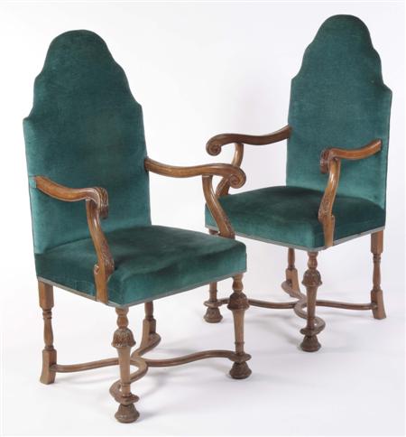 Appraisal: A pair of walnut framed high back armchairs In the