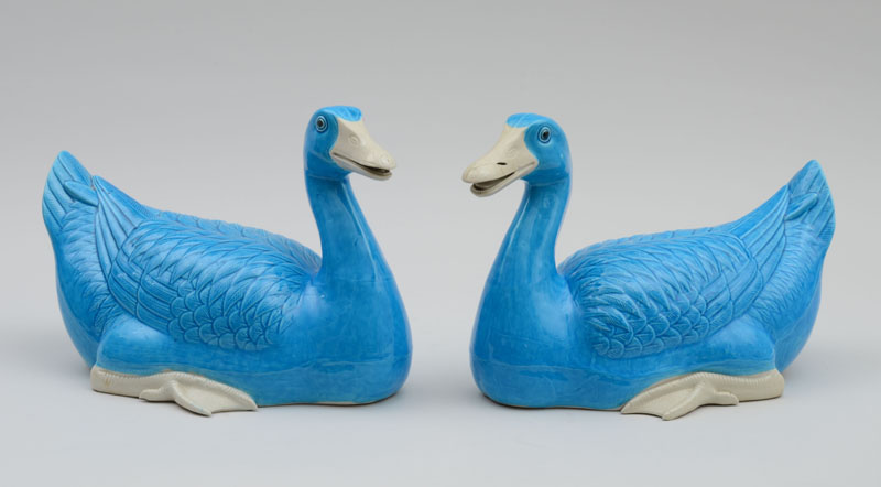 Appraisal: PAIR OF CHINESE TURQUOISE-GLAZED PORCELAIN FIGURES OF SWIMMING DUCKS Each