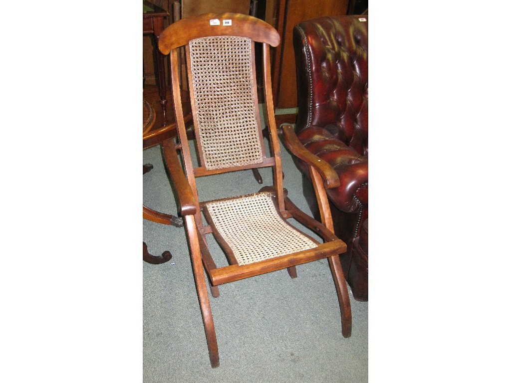 Appraisal: Cane seated and backed folding deck chair