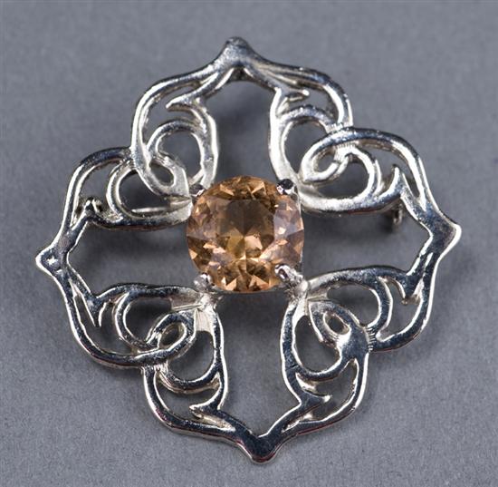 Appraisal: Silver pin in Celtic design with peach topaz Pin is