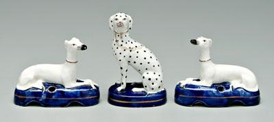 Appraisal: Three British ceramic dogs pair quill holders formed as recumbent