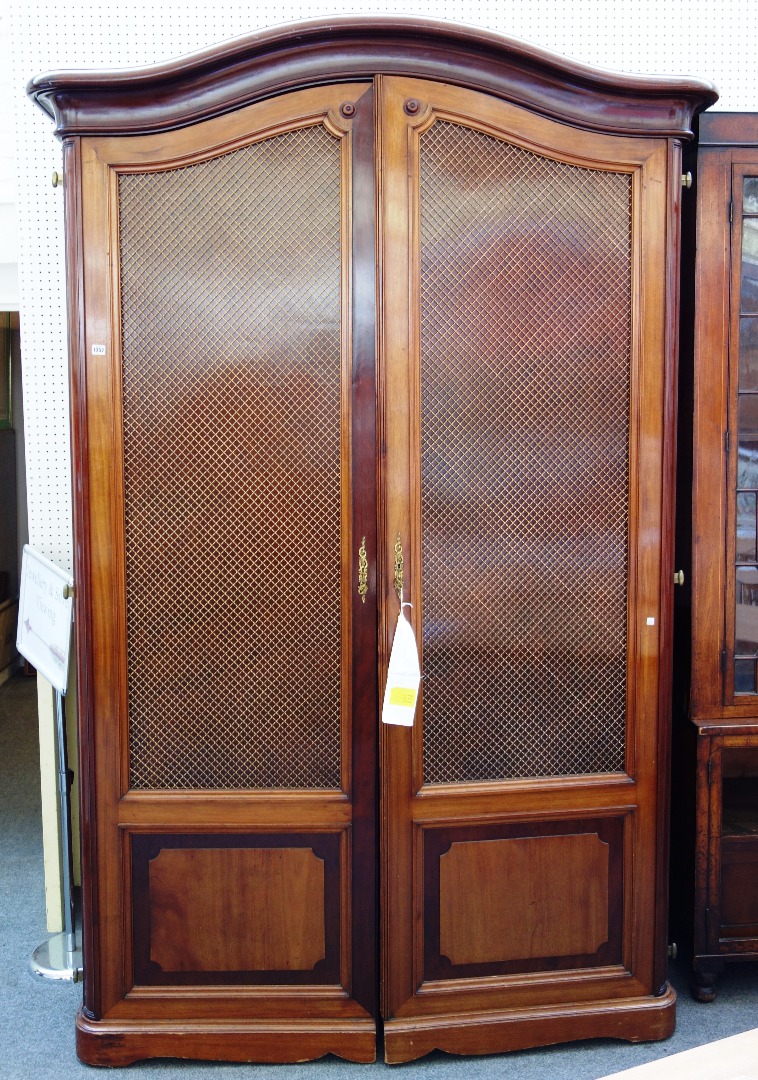 Appraisal: An early th century mahogany two door armoire by Francois