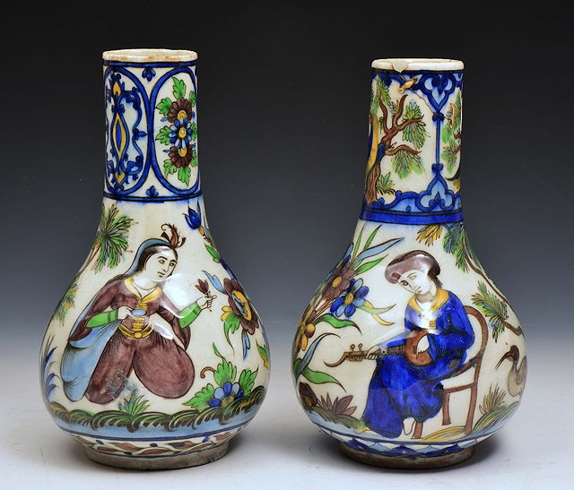 Appraisal: A PAIR OF PERSIAN QAJAR BALUSTER VASES with scene of