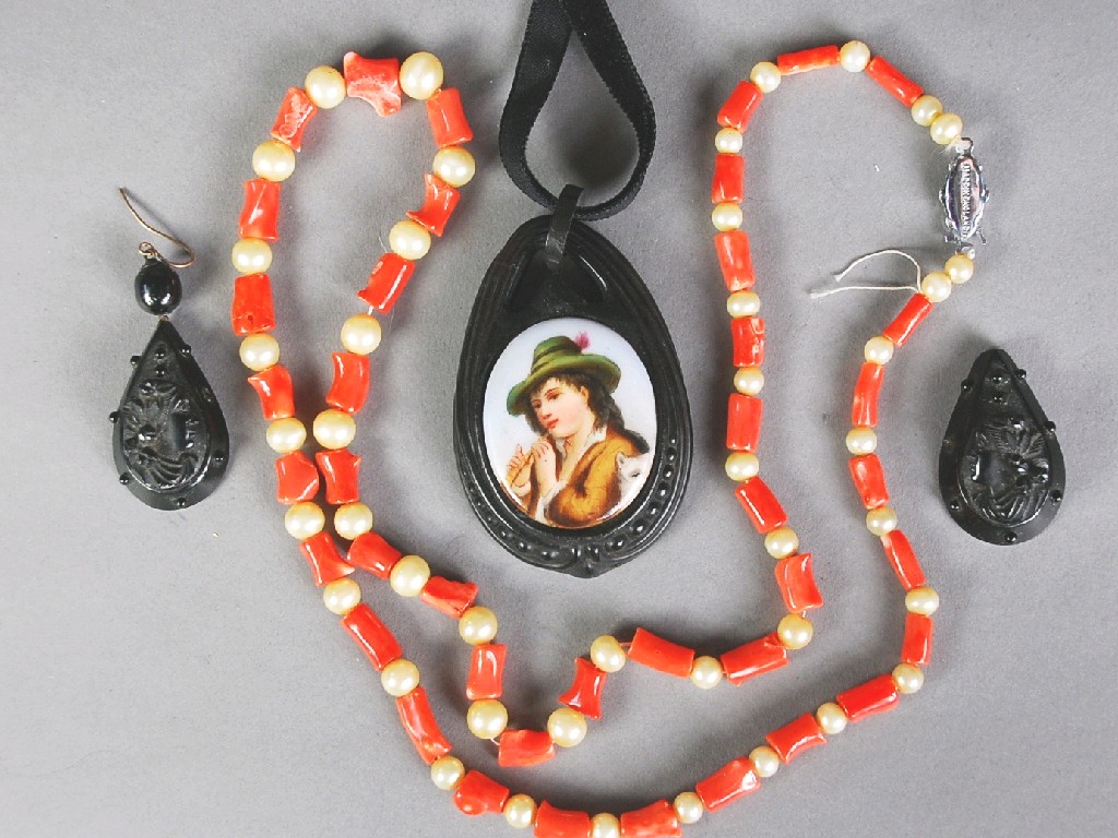 Appraisal: JET LARGE PENDANT set with a porcelain miniature of a