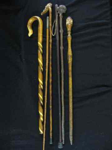 Appraisal: Collection of Canes Walking Sticks includes carved man tiger sterling