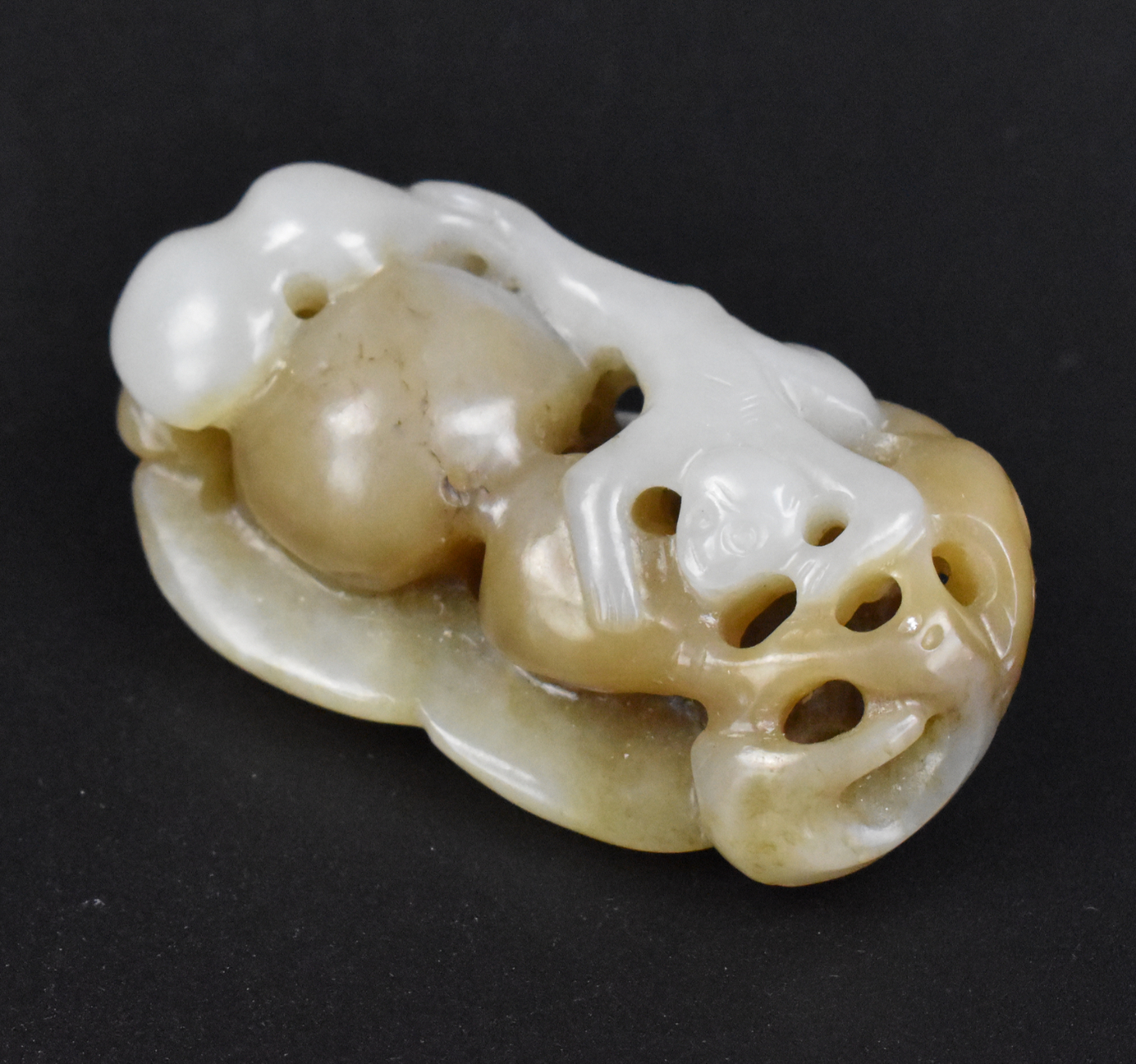 Appraisal: A Chinese heitian jade pendant with monkey and gourd dating