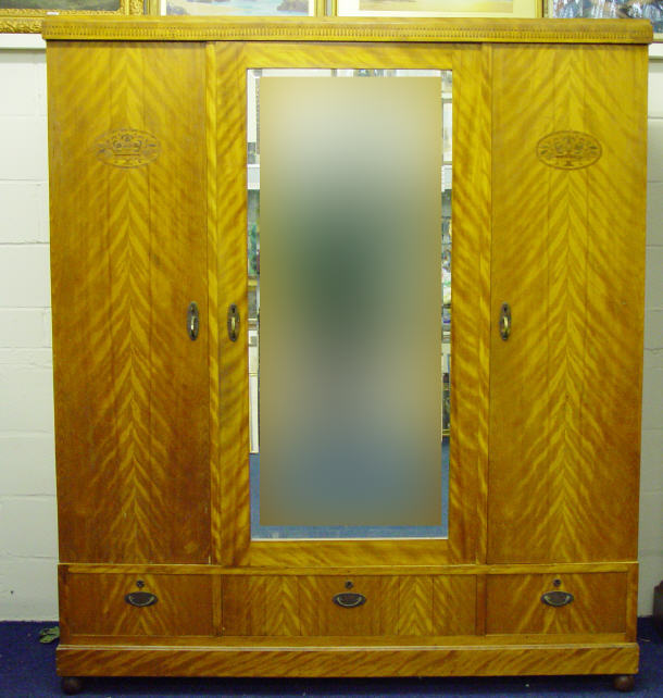 Appraisal: Victorian satinwood wardrobe the central bevel edged mirror door enclosing