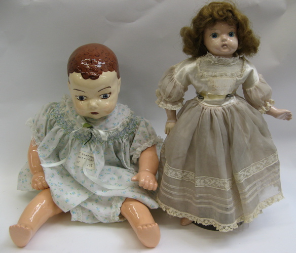 Appraisal: TWO GLAZED CHINA HEAD DOLLS One is a boy baby