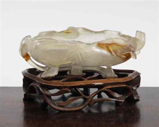 Appraisal: A Chinese agate brush washer carved as a curled lotus