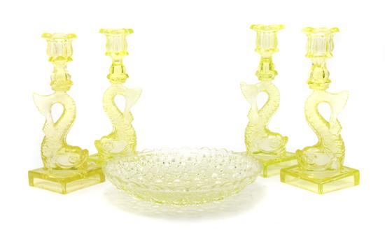 Appraisal: A Set of Four Glass Candlesticks each of dolphin form