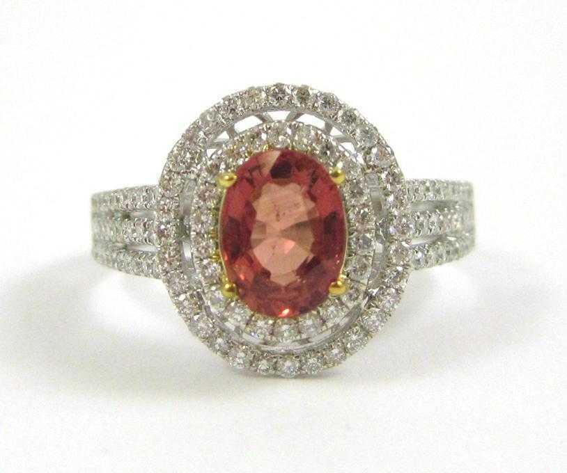 Appraisal: ORANGE SAPPHIRE AND FOURTEEN KARAT GOLD RING The white and