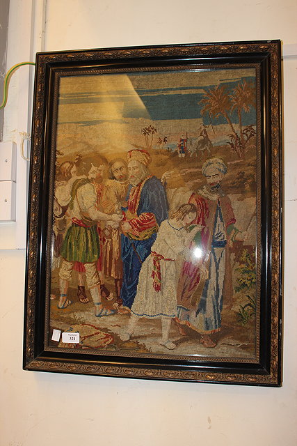 Appraisal: A VICTORIAN BERLIN WOOLWORK PICTURE depicting Joseph being sold into