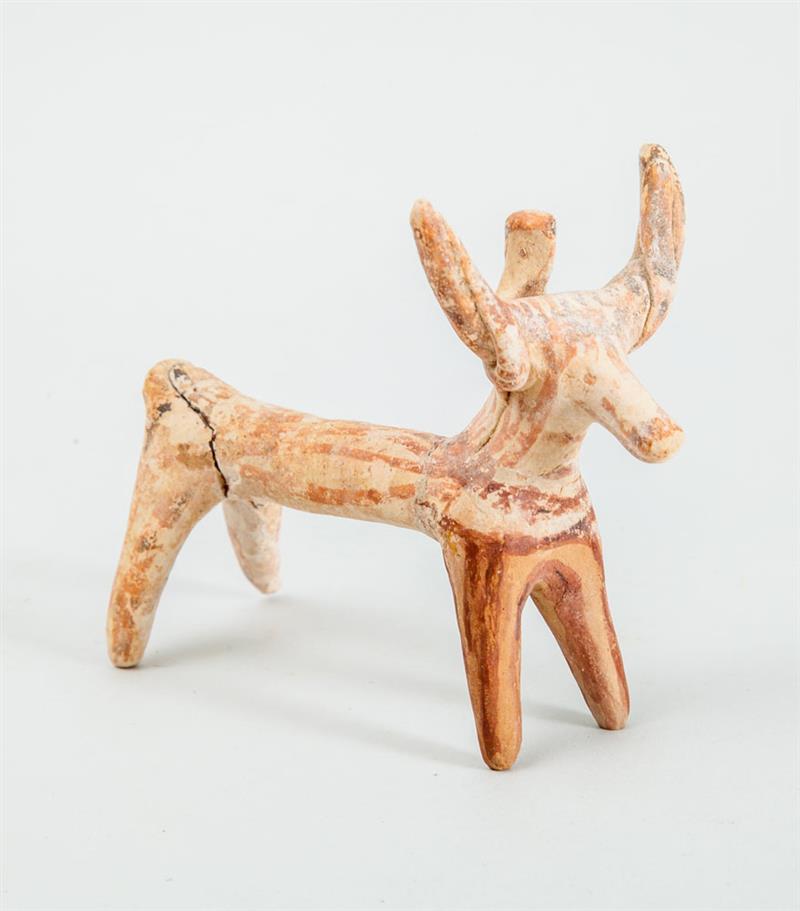 Appraisal: BOEOTIAN TERRACOTTA VOTIVE FIGURE OF A DEER Standing foursquare with