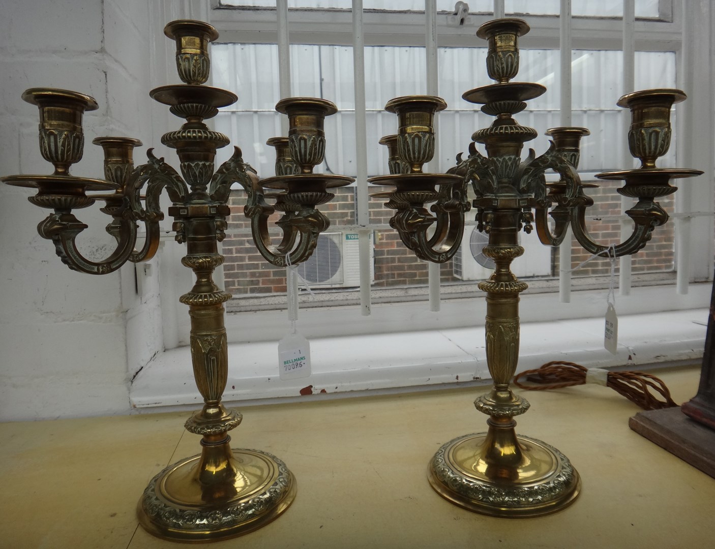 Appraisal: A pair of Victorian bronze five light candelabra the turned