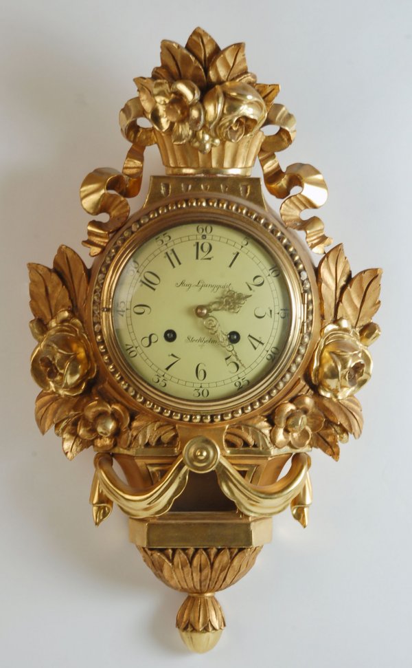 Appraisal: Stockholm Cartel wall clock gilt gessoed wood case with applied