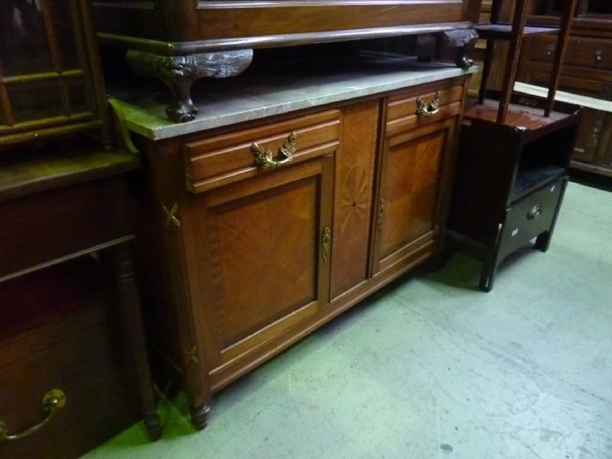 Appraisal: A continental side cupboard with decorative veined marble slab top