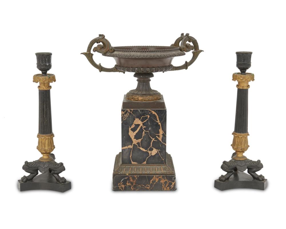 Appraisal: A pair of French Empire-style bronze candlesticks with tazza Fourth-quarter