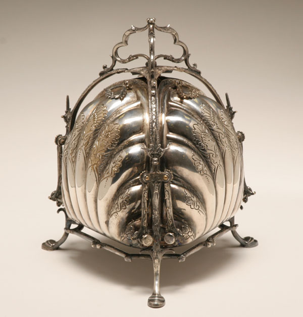 Appraisal: Ornate chased and engraved Victorian silverplate bun warmer Mechanical tri-section