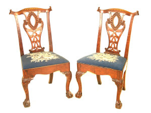 Appraisal: Two Georgian Chippendale style mahogany dining chairs the yoked top