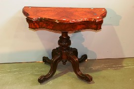 Appraisal: A Victorian burr walnut card table with leather inset