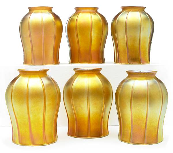 Appraisal: A group of six Quezal gold iridescent ribbed glass floriform