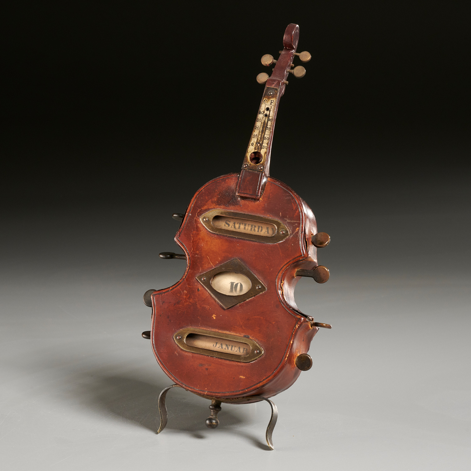 Appraisal: UNUSUAL MINIATURE VIOLIN CALENDAR THERMOMETER th c likely Continental leather