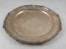 Appraisal: A silver charger with gadrooned lobed rim cm across marked