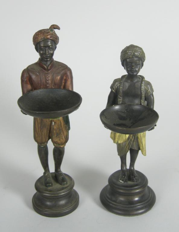 Appraisal: Two cold painted bronze Figures House Servants holding out dishes