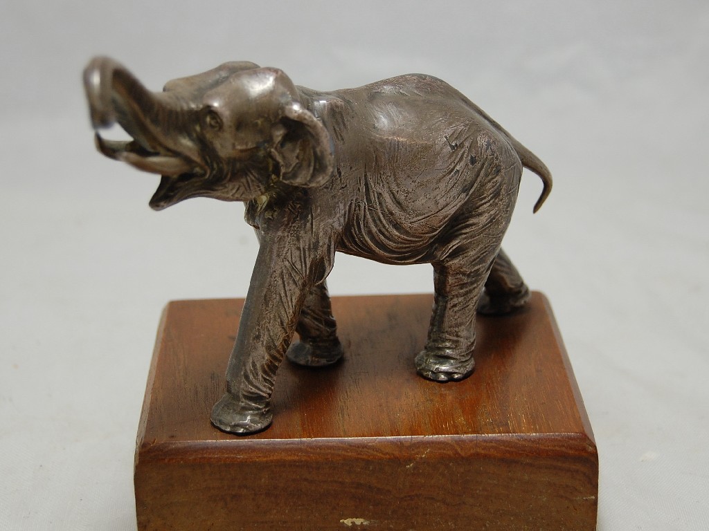 Appraisal: Heavy cast metal elephant paperweight on plinth made from the