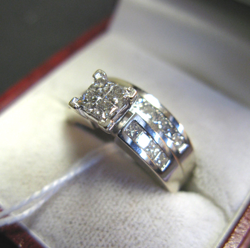 Appraisal: DIAMOND AND FOURTEEN KARAT WHITE GOLD WEDDING SET the engagement