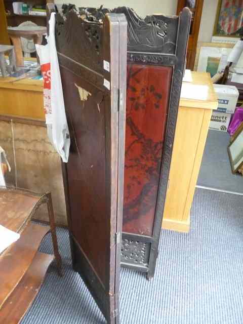 Appraisal: AN ORIENTAL CARVED FOUR FOLD SCREEN with lacquered panels pierced