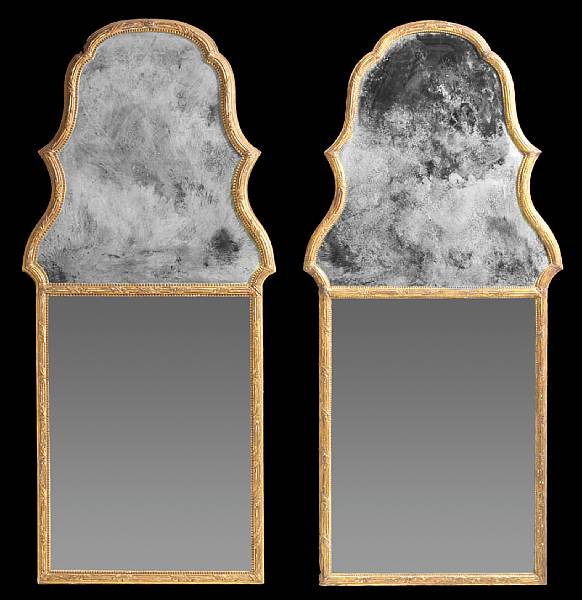 Appraisal: A pair of George III style giltwood and gesso mirrors