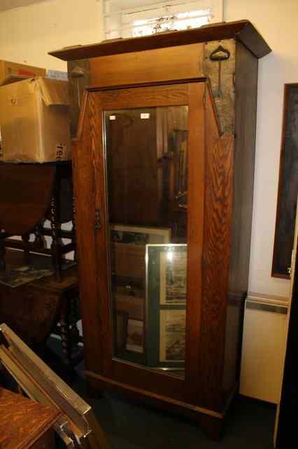 Appraisal: AN ART NOUVEAU OAK WARDROBE enclosed by single mirror panelled