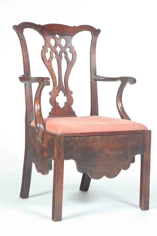 Appraisal: CHIPPENDALE CHAMBER ARMCHAIR American late th century walnut Shaped crest