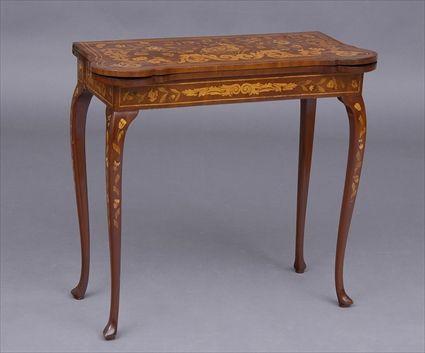 Appraisal: DUTCH ROCOCO MARQUETRY-INLAID GAMES TABLE The folding top with outset