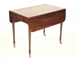 Appraisal: A mahogany Pembroke table th century the rounded top above