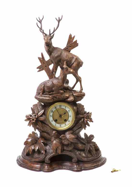 Appraisal: A Black Forest Carved Wood Mantel Clock depicting a stag