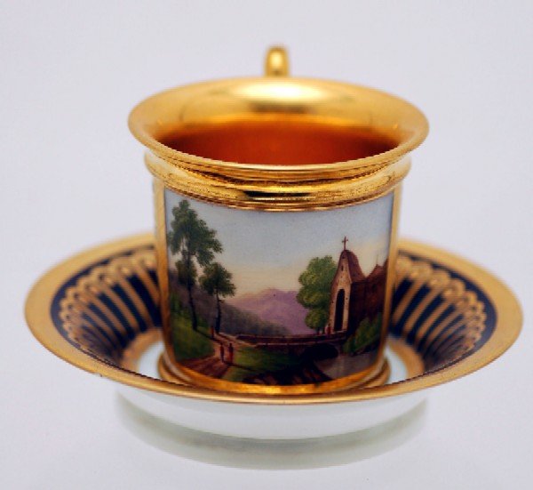 Appraisal: Scenic cup and saucer cup with gilt decoration on cobalt