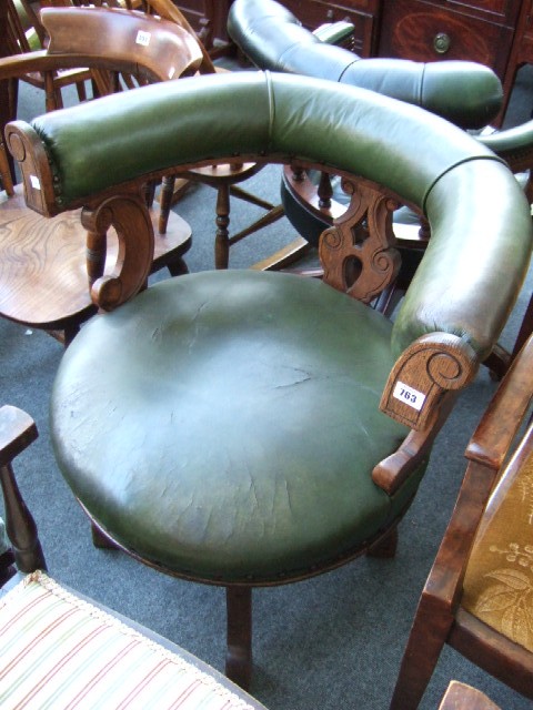 Appraisal: A late Victorian oak framed tub office swivel chair with