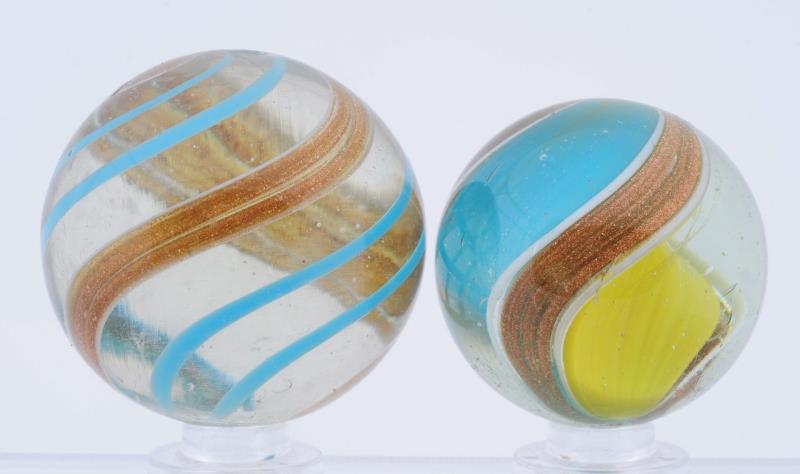 Appraisal: Lot Of Lutz Marbles The smaller is a large ribbon