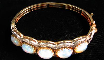 Appraisal: karat yellow and white gold opal and diamond bangle bracelet