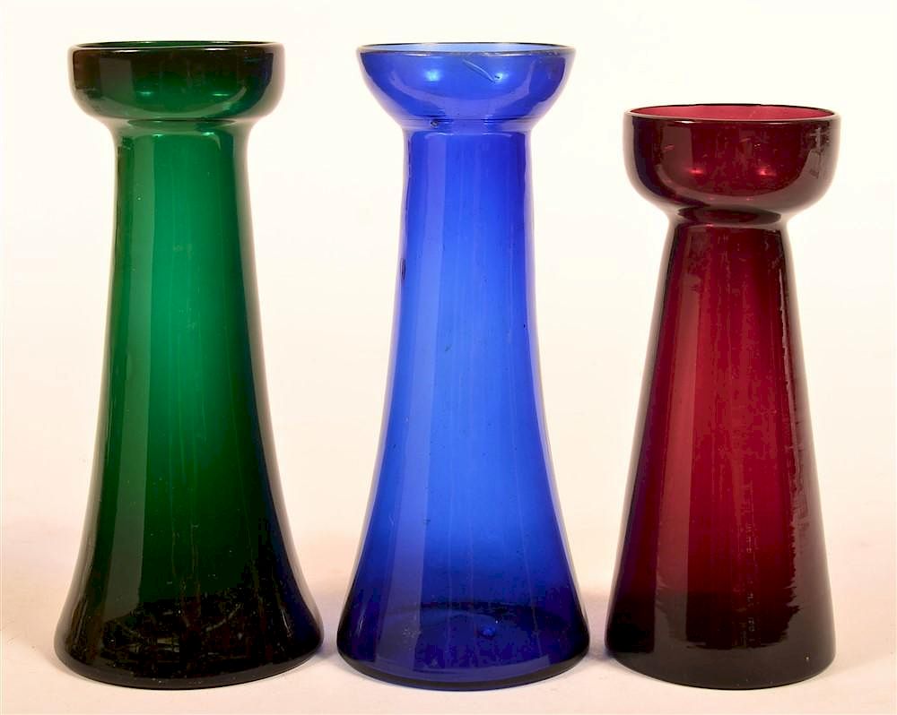 Appraisal: Three Blown Colored Glass Hyacinth Vases Three Blown Colored Glass