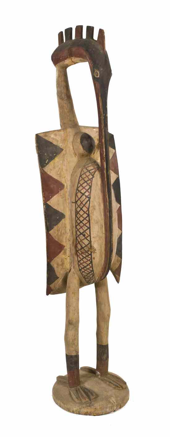 Appraisal: A Carved and Polychrome Decorated Senufo Figure depicting a standing